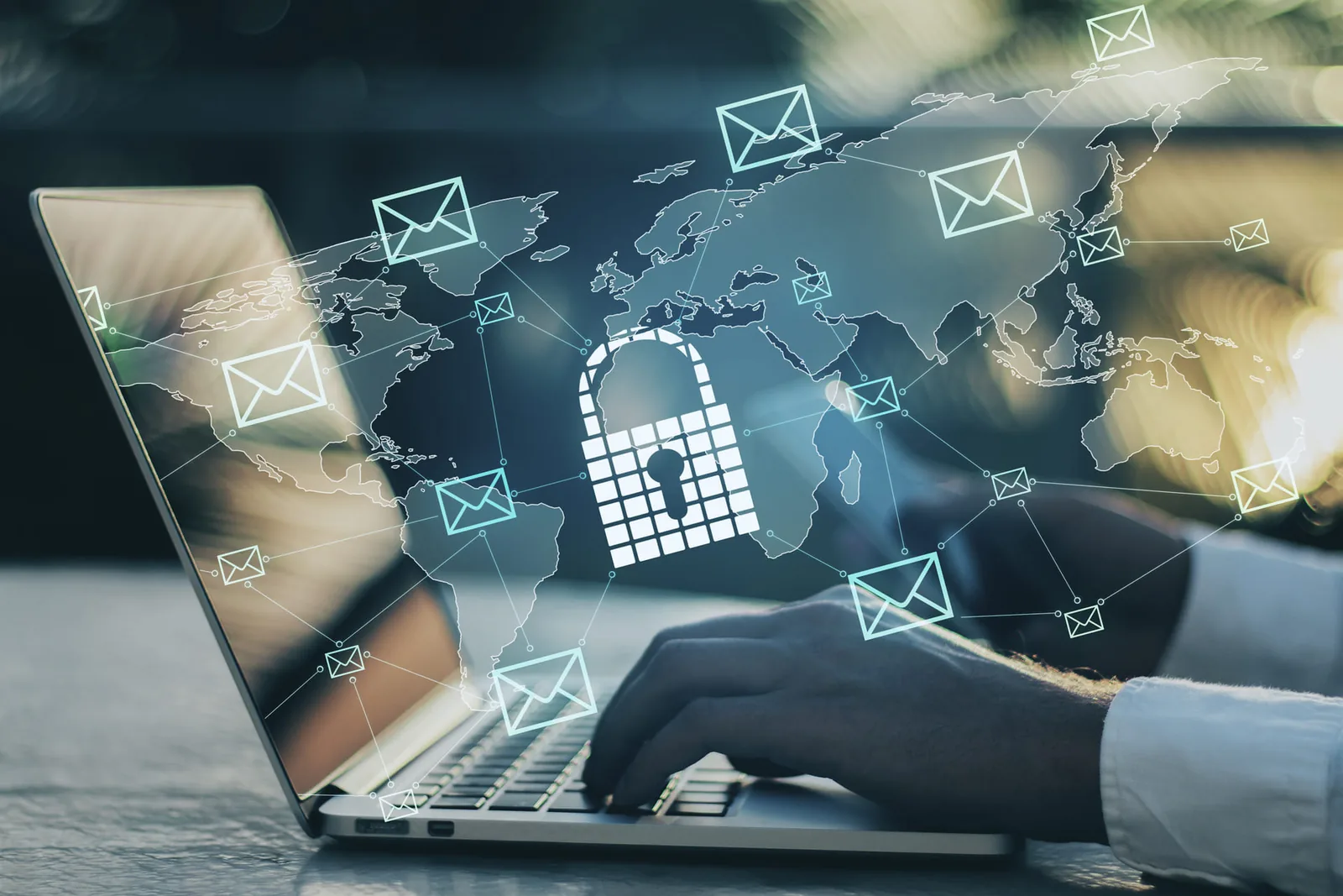 Person using a laptop protected by email security and phishing protection